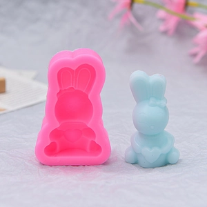 Macro detail of cartoon bunny silicone mold showing heart and bow tie relief texture