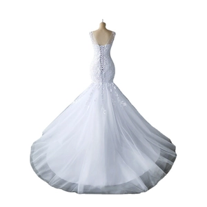 Elegant white mermaid bridal gown featuring lace embroidery and a corset lace-up back