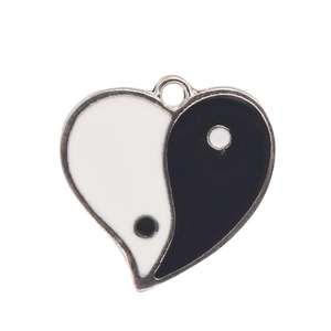 Heart-shaped Yin Yang Tai Chi enamel pendant with silver alloy rim on white background