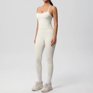 Detail of high-waisted off-white yoga set with ribbed texture and slim fit design