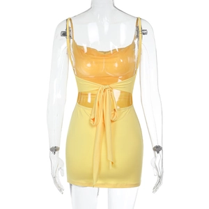 Detail of yellow bodycon mini dress showing backless design with adjustable tie-up ribbons