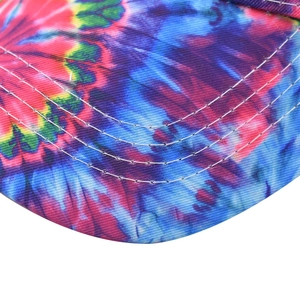 Detail of colorful tie-dye baseball cap brim with white four-row stitching on twill fabric