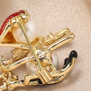 Detailed macro view of the gold alloy Christmas brooch back with safety pin clasp