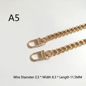 Close-up of golden metal bag strap chain with lobster clasps, 2.5mm wire and 8.3mm width