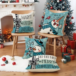 Set of 4 Christmas snowman linen pillow covers in festive blue and white living room decor
