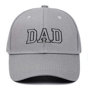 Close-up of grey baseball cap featuring premium black DAD embroidery and six-panel design