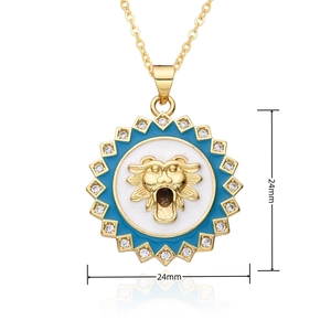 Detail of 24mm gold lion head pendant with blue enamel and sparkling zircon borders