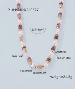 Macro shot of titanium steel gold necklace with amethyst and pearls showing size details