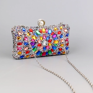 Elegant evening clutch bag with colorful rhinestones and pearl clasp, side view