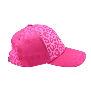Close-up of pink leopard print kids baseball cap with adjustable buckle on canvas