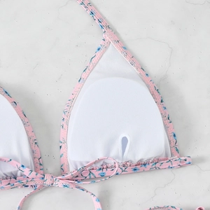 Detail of floral bikini top showing white mesh lining and removable padded bra inserts