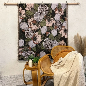Bohemian woven cotton blanket featuring pomegranate flower patterns and fringe trim