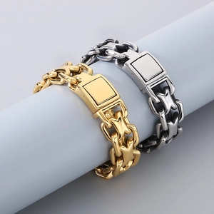 Close-up of industrial gold and silver stainless steel chunky chain bracelets on stand