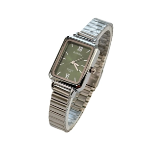 Elegant rectangular green dial quartz watch with silver bamboo metal strap on white background
