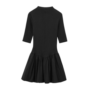 Slim fit black mock neck midi dress featuring ribbed knit top and pleated A-line skirt
