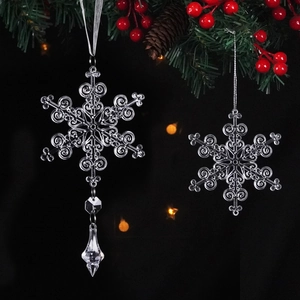 Transparent Christmas snowflake ornaments with crystal drop hanging on pine branches