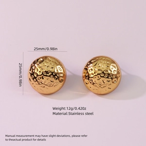Macro detail of 25mm gold hammered stainless steel disc earrings weighing 12g