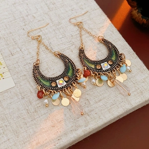 Detail of bohemian moon earrings with colorful beads, rhinestones and crystal drop pendants