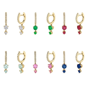 Detail view of gold-plated hoop earrings with vibrant colorful zircons and micro-pave diamonds