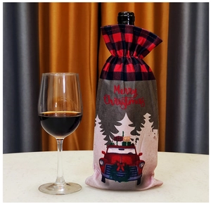 Detail of red and black buffalo plaid Christmas wine bottle bag with Merry Christmas text