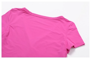 Close-up of the double-stitched V-neckline on a rose pink breathable yoga t-shirt