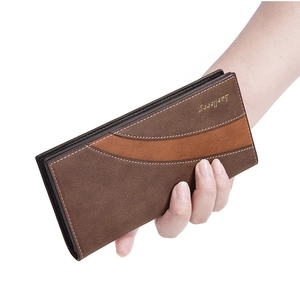 Detailed close-up of a brown textured leather long wallet for men with a bifold design