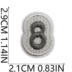 Detail of embroidered number 8 patch in grey and white with precise dimension markings