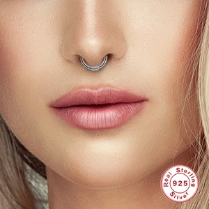 Close-up of S925 sterling silver septum hoop with coiled wire detail on model