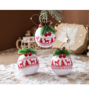 Detail of Christmas buffalo plaid ornaments with pine needles and red berry accents