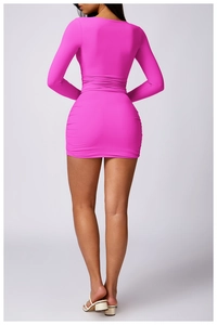 Detail view of the back of a slim-fit ruched long sleeve mini dress in vibrant rose pink