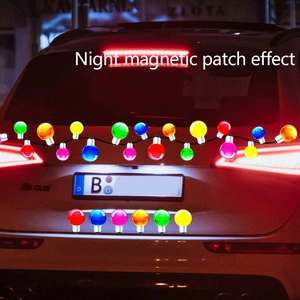 Night magnetic patch effect of colorful Christmas bulb stickers on a white car rear
