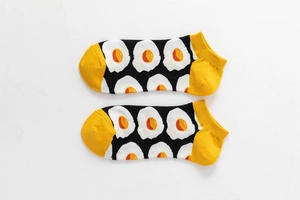 Detailed side view of cotton low cut socks featuring creative fried egg pattern