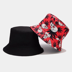Detail of reversible bucket hat in black and red with skull and leaf pattern prints