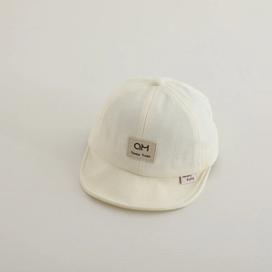 Detailed texture of baby cotton baseball cap with square patch and soft brim