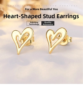 Macro view of minimalist hollow heart stud earrings with 18K gold plated polished finish