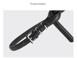 Detail of black pebbled leather belt with silver square buckle and double metal loops