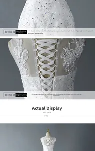 Detailed view of the elegant lace-up back and intricate floral embroidery on white wedding gown