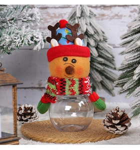 Detailed view of plush reindeer lid and transparent festive candy jar with scarf decor