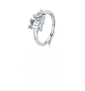Detailed shot of S925 silver ring featuring heart and emerald cut stones in white background