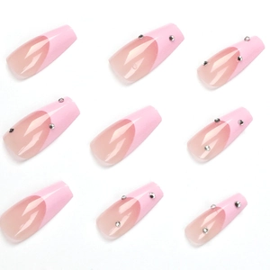 Pink French coffin press-on nails with rhinestone accents on a clean white background