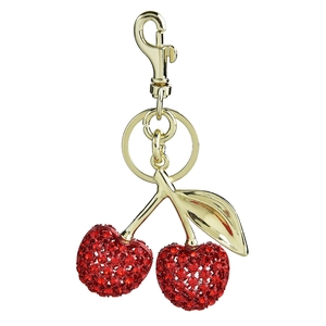 Chic gold cherry keychain with red rhinestones and metallic leaves on white background