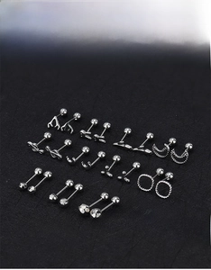 Macro display of silver stainless steel cartilage studs with various unique shapes