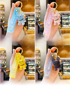 Detailed view of colorful translucent resin French Bulldog keychains with silicone straps
