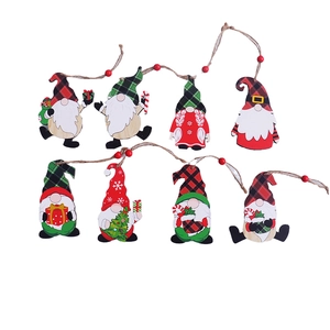 Set of 8 painted wooden Christmas gnome ornaments with plaid patterns and jute strings