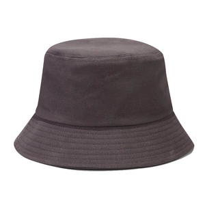 Detailed view of dark grey cotton bucket hat with parallel stitched brim and twill texture