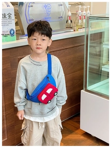 Detailed view of kids cartoon car chest bag with red contrast pocket and blue strap