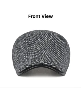 Front view of grey plaid woolen flat cap with black leather trim for winter