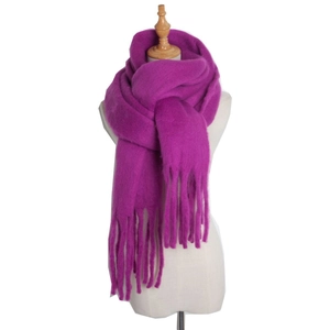 Detail view of purple mohair scarf with tassels on model for winter styling