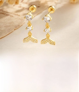Macro shot of fishtail drop stud earring with coffee gold plating and cubic zirconia detail