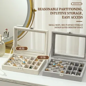 Velvet jewelry box with clear window and multi-slot interior in beige and dark grey
